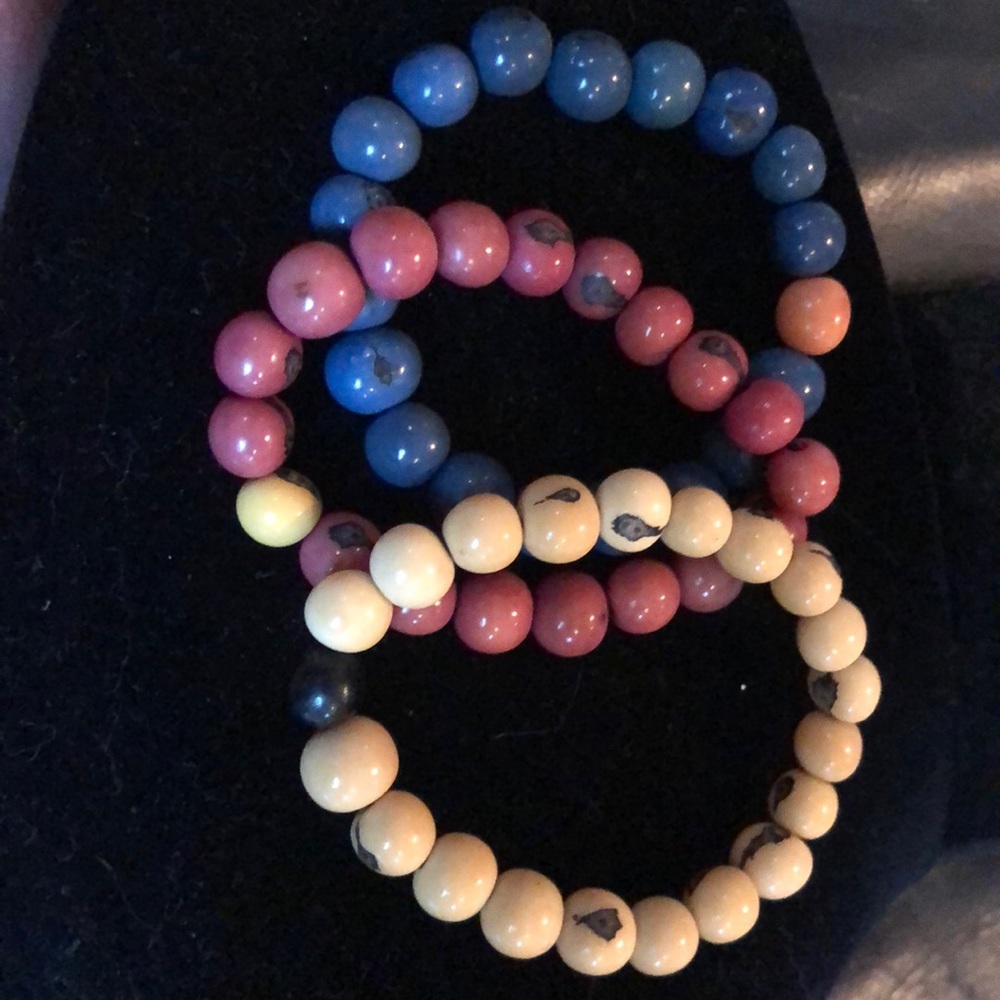Three wooden bead bracelets